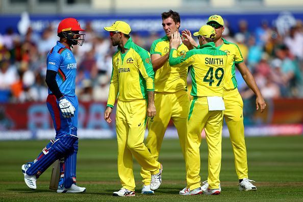 Pat Cummins celebrates the fall of an Afghanistan wicket