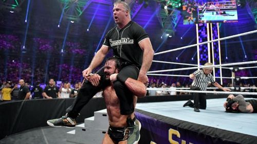 Shane McMahon and Drew McIntyre celebrating