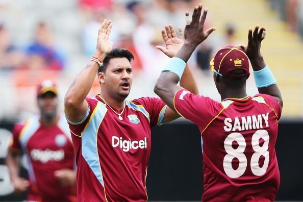 Ravi Rampaul is seeing celebrating with Darren Sammy