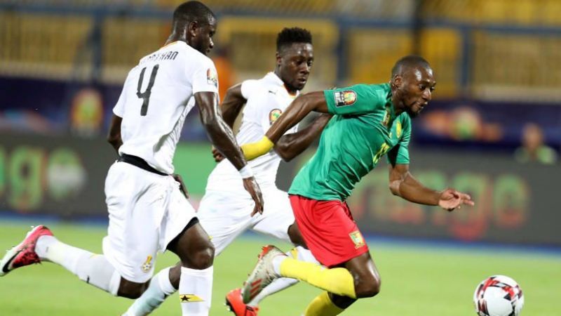 Cameroon&#039;s Toko Ekambi (r), attempting to break away from Ghana&#039;s hawk-eyed defenders