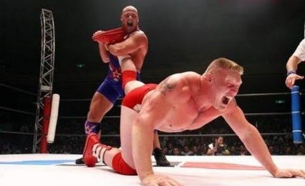 Kurt Angle applying the Ankle Lock on Brock Lesnar