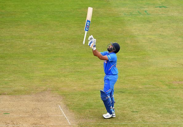 Rohit Sharma celebrates after scoring a century