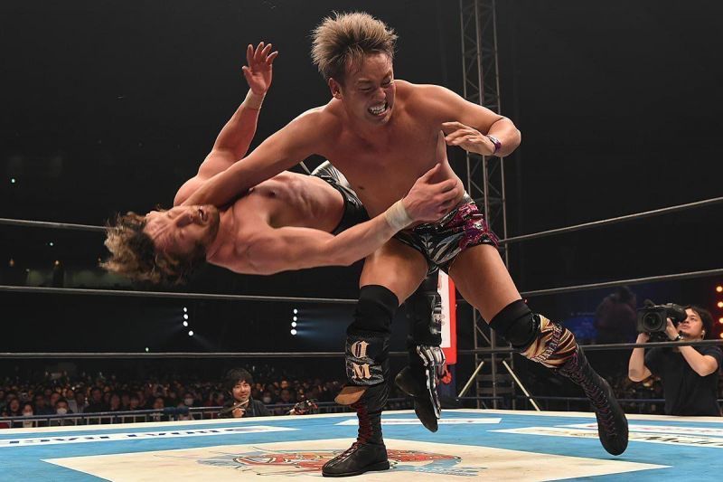 Okada hits Kenny Omega with a thunderous Rainmaker clothesline.