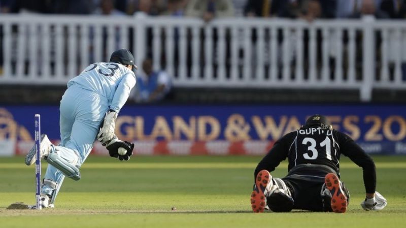 Buttler crashing the stumps to run Guptill out, ending the super-over in a tie