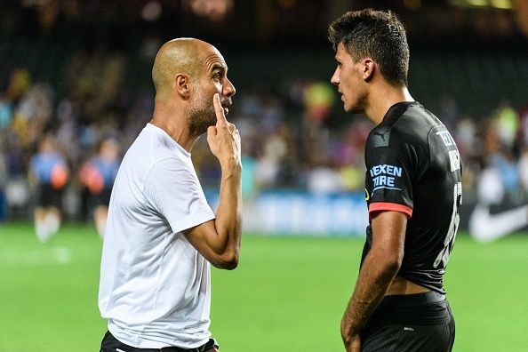 Pep Guardiola and Rodri