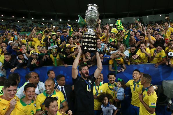 Alisson Becker with the Copa America trophy