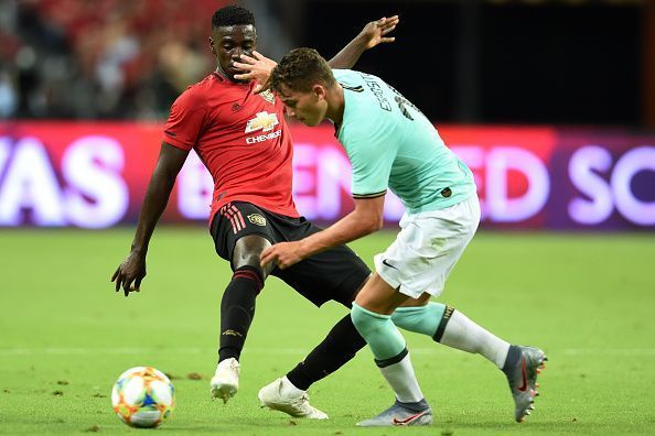 Axel Tuanzebe makes a tackle