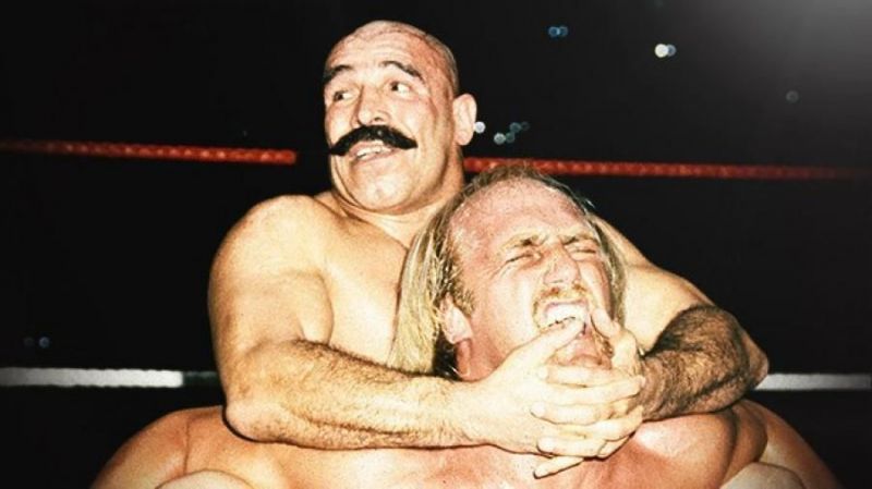 Hulk Hogan is trapped in the dreaded Camel Clutch by the Iron Sheik