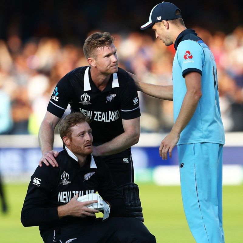 Martin Guptill being consoled by Jimmy Neesham and Chris Woakes