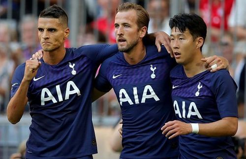 Harry Kane celebrates with Lamela and Son after opening the scoring in their Audi Cup semi-final win