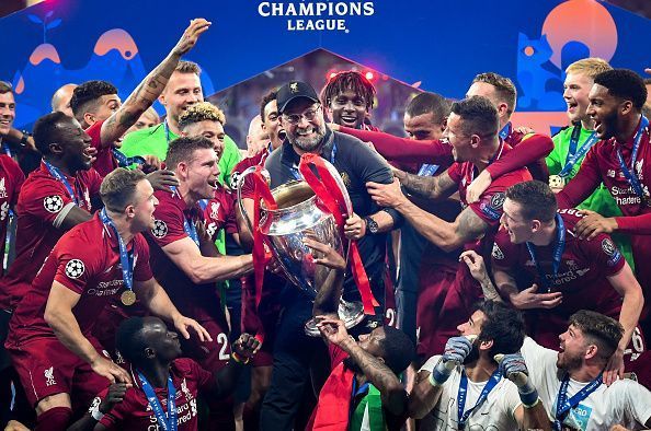 The Liverpool team with the Champions League trophy