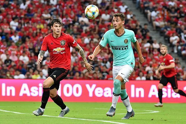 Victor Lindelof (left) in action battling for possession