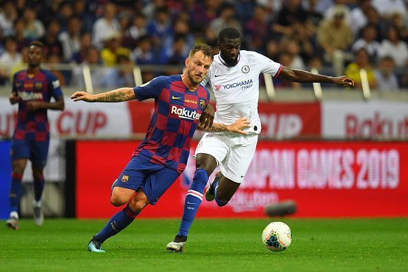 Ivan Rakitic battles for the ball with Tiemoue Bakayoko