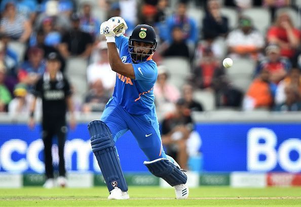 Rishabh Pant drives a ball through the covers