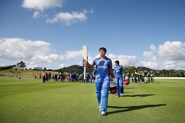 Darwish Rasooli walking back after playing a match-winning knock against Pakistan U-19