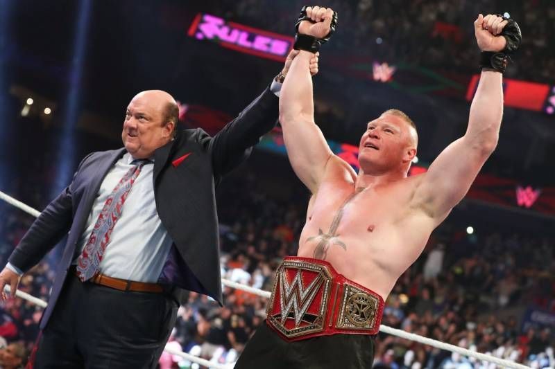 Brock Lesnar and his advocate Paul Heyman raise their hands at Extreme Rules after Brock&#039;s well deserved victory over Seth Rollins.