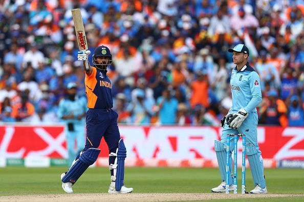 Virat Kohli lifts his bat as England wicketkeeper Jos Buttler looks on