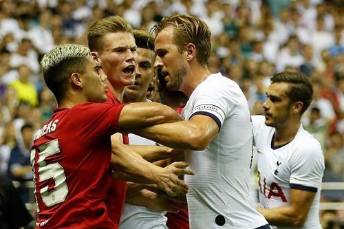 Manchester United youngsters Andreas Pereira and Scott McTominay holding their own against Tottenham's Harry Kane in a pre-season friendly