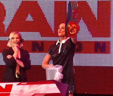 Renee Young Looks On As Alundra Blayze Is About To Toss Yet Another Championship In The Trash