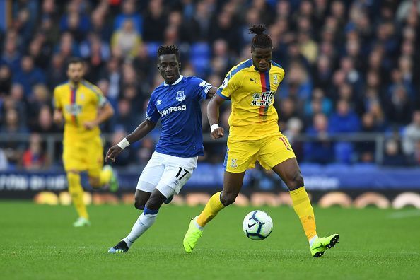 Gueye and Zaha battle for the ball