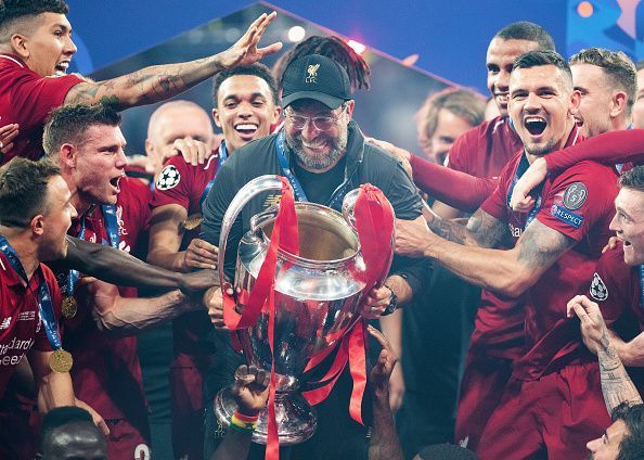 Jurgen Klopp lifts his first trophy as Liverpool manager