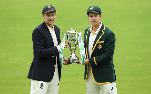England and Australia skippers Joe Root and Tim Paine posing for the Ashes trophy