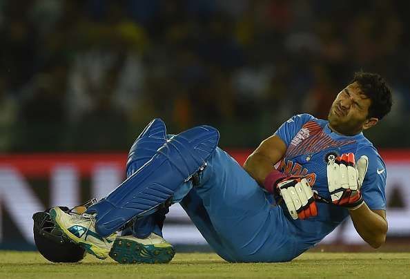 Yuvraj Singh grimaces in pain during the game against Australia