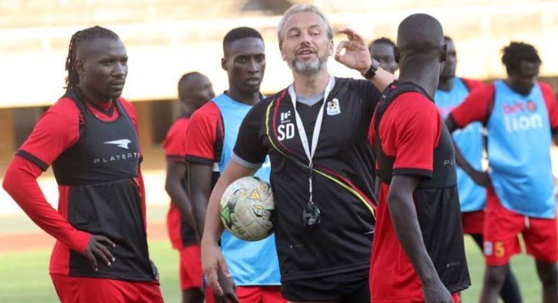 Uganda&#039;s gaffer, Sebastien Desabre (c), takes his charges through a training session