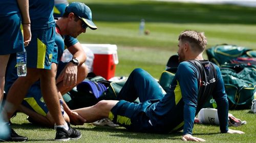 David Warner receives treatment