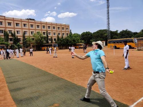 Brad Hogg in bowling action with the school team of Velammal Group of Institutions, Madurai