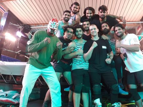 Zenith pictured with pro wrestlers from India's 'Wrestle Square' academy