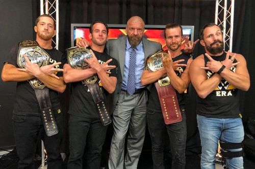 Triple H with the Undisputed Era, all of whom are former ROH stars