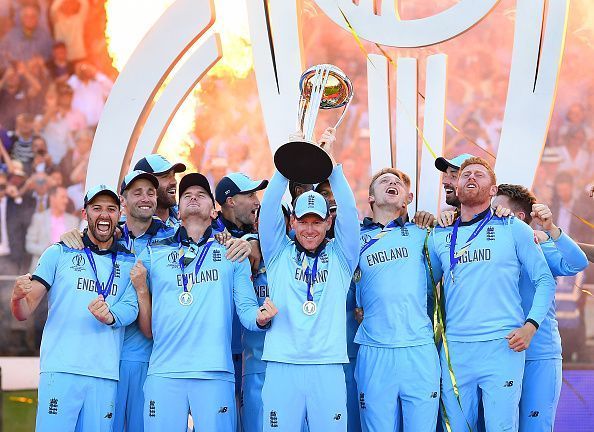 England celebrate with the World Cup trophy.