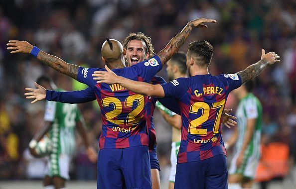 Griezmann celebrates with Carles Perez and fellow substitute Arturo Vidal during their 5-1 rout