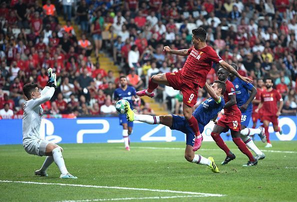 Roberto Firmino lunging for the ball to help Liverpool equalise