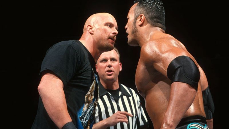 Stone Cold Steve Austin faces off with the Rock.