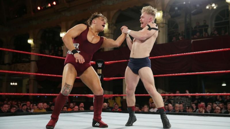 Tyler Bate locks in a joint submission on Pete Dunne during one of their many stellar encounters.