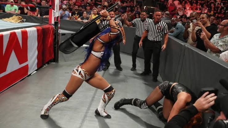 Sasha Banks beats down Lynch