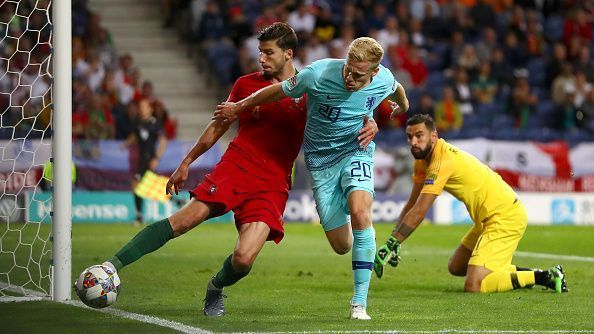 Van de Beek (right) fights for the ball in Netherlands&#039; UEFA Nations final against Portugal