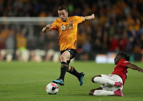 Aaron Wan-Bissaka lunges into a tackle.