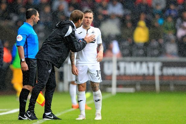 Graham Potter (left) instructing Barrie McKay (right) during 2018/19 EFL Championship season