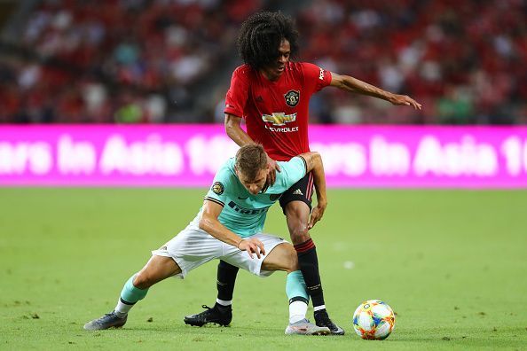 Tahith Chong tussling for the ball against Inter Milan in pre-season