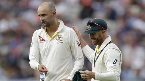 Nathan Lyon with David Warner