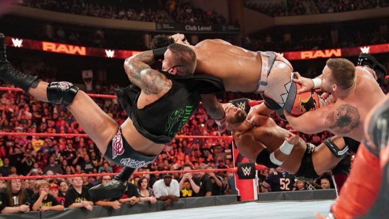 Randy Orton giving an RKO to Xavier Woods