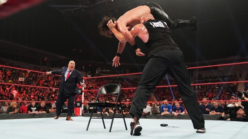 Paul Heyman watches his client demolish Seth Rollins