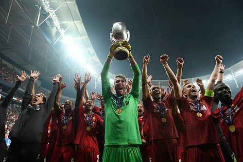 Adrian celebrates with the UEFA Super Cup trophy aloft after Liverpool's penalty shootout win over Chelsea