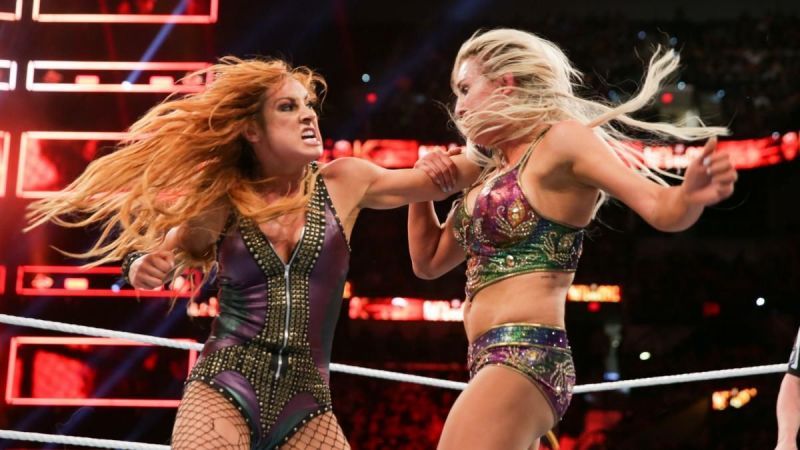 Becky Lynch and Charlotte Flair engage in a fierce struggle for dominance.
