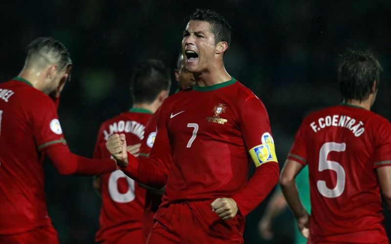 Cristiano Ronaldo rejoices after scoring one of his three goals in Belfast