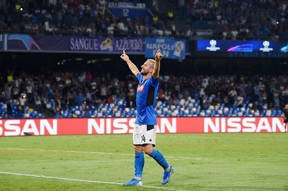 Mertens celebrates with the home supporters after their smash-and-grab 2-0 victory