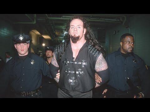 The Undertaker being arrested after trying to sacrifice The Big Bossman